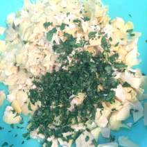Add artichokes, olive oil, grated cheese, garlic, thyme, and parsley to bowl