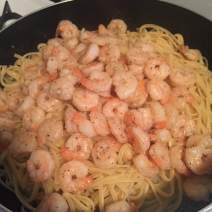 Add cooked shrimp back to pan