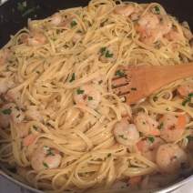 Stir pasta, shrimp and parsley to combine with sauce